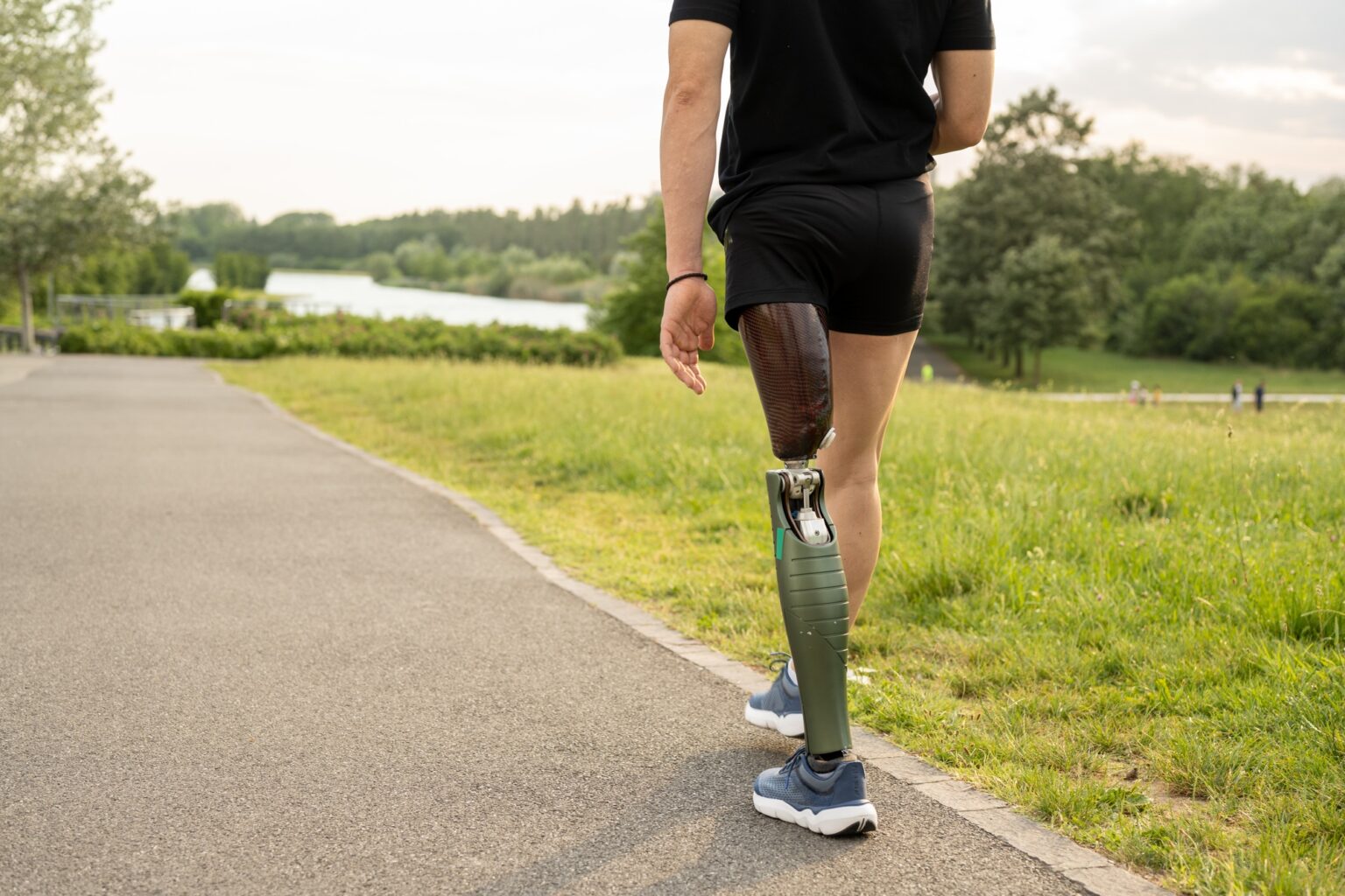 Details of a walk of a young man with prosthetic leg